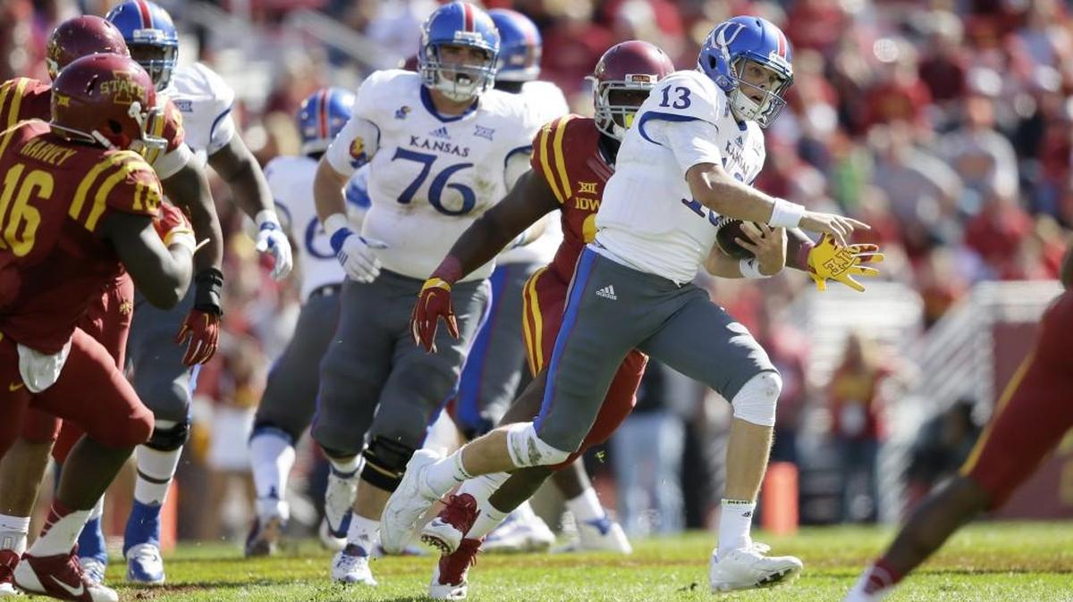 
Kansas quarterback Ryan Willis runs the ball during the second half of last Saturday’s game at Iowa State.
