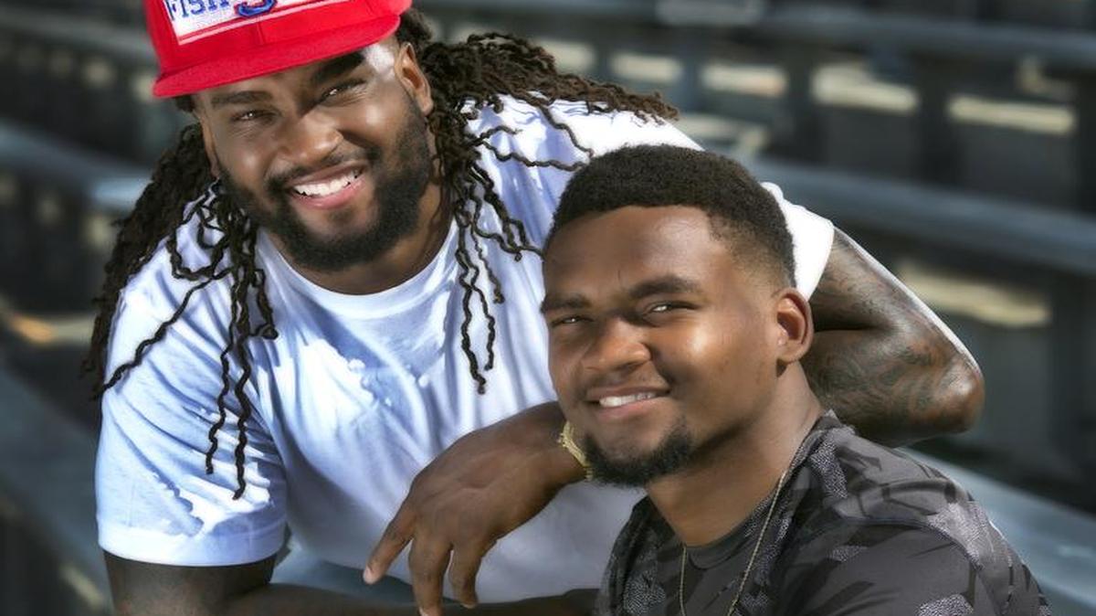 Kansas safety Fish Smithson (right) with his brother Shaky, who played wide receiver at Utah.