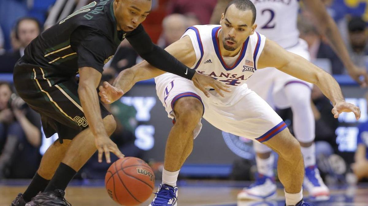 
Kansas forward Perry Ellis tries to steal the ball from Baylor guard Lester Medford last season in Lawrence.
