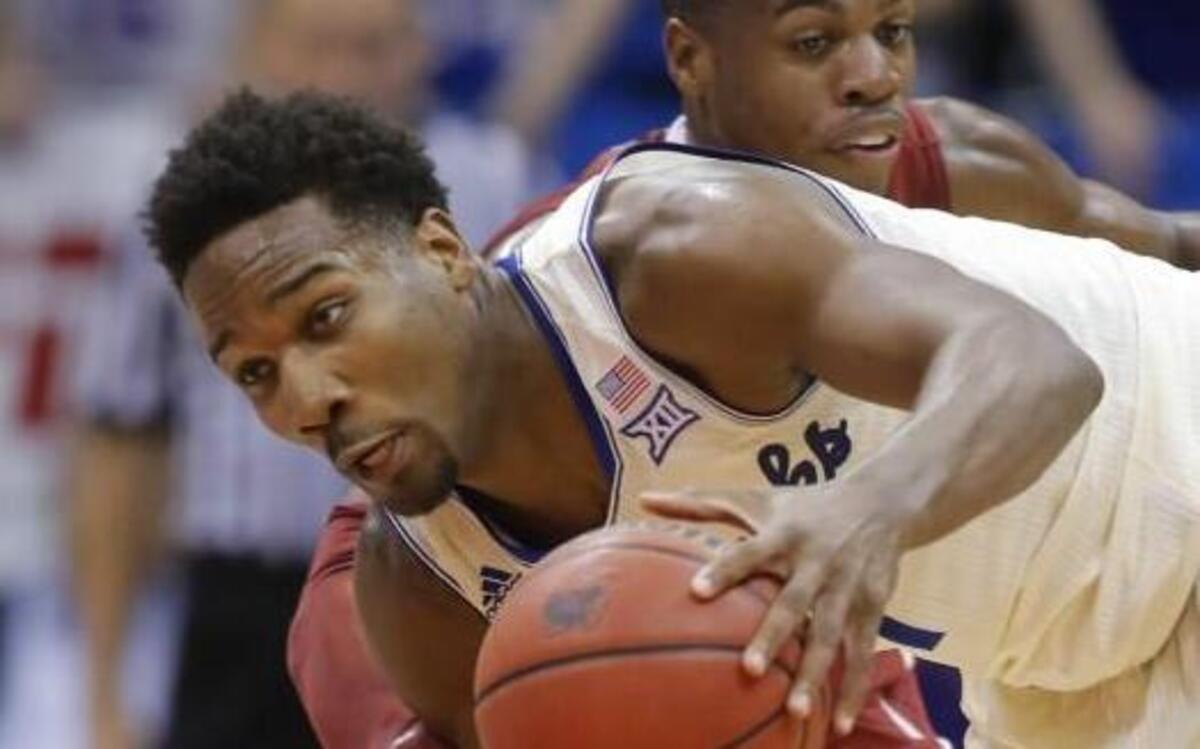 Kansas guard Wayne Selden steals the ball from Oklahoma guard Buddy Hield during the first half last season at Allen Fieldhouse.