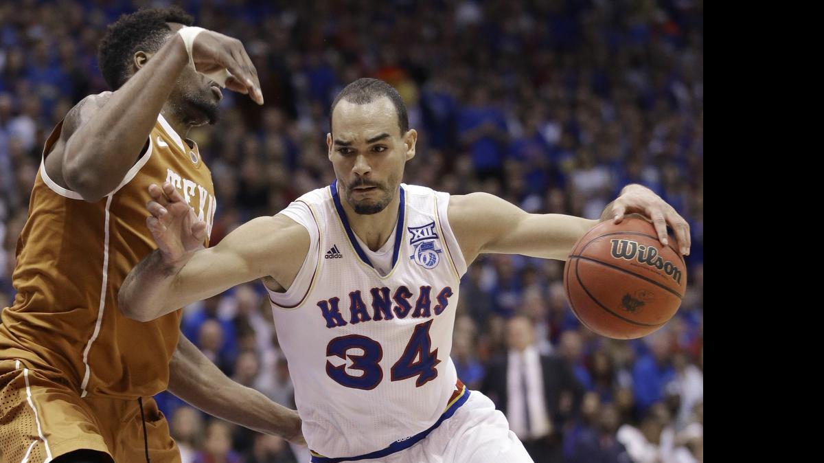 Kansas forward Perry Ellis drives to the basket against Texas on Feb. 28 in Lawrence.