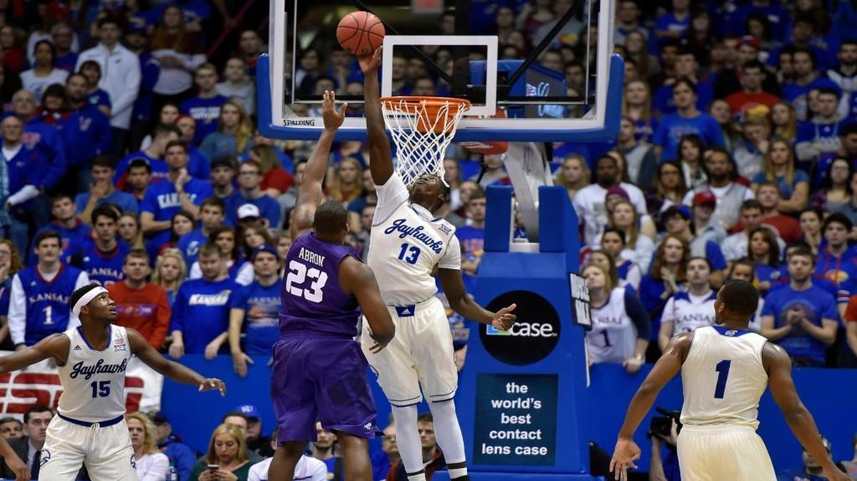 Kansas’ Cheick Diallo swats away a shot by TCU’s Devonta Abron during the first half Saturday at Allen Fieldhouse.