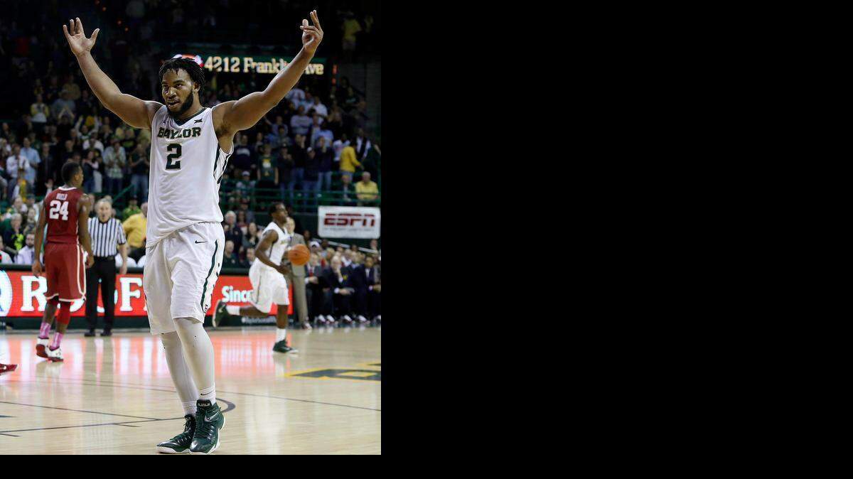 
Baylor forward Rico Gathers raises his arms in victory. (AP Photo/Jerry Larson)
