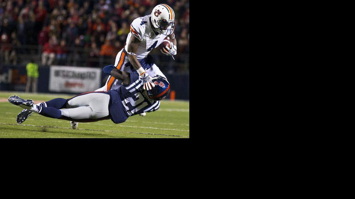 
Mississippi defensive back Senquez Golson (21) tackles Auburn wide receiver Quan Bray. (Nov.1, 2014) 
