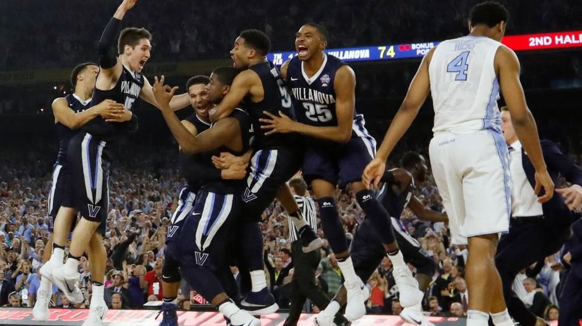 Villanova players celebrate after defeating North Carolina on Kris Jenkins’ three-pointer at the buzzer of the national championship game on Monday in Houston. Villanova won 77-74.