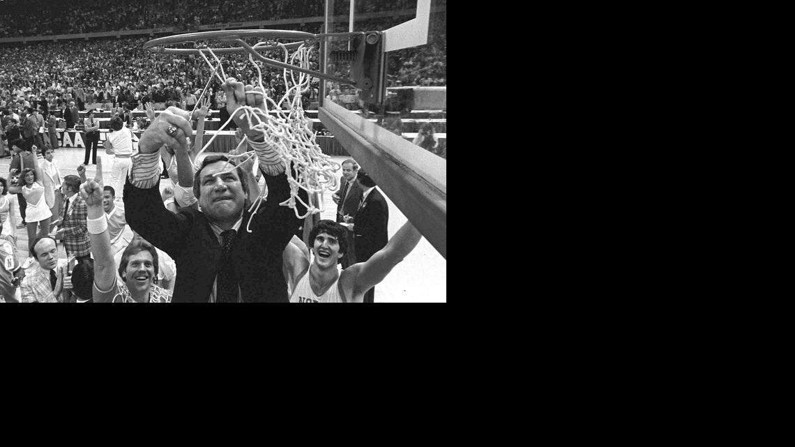 
North Carolina basketball coach Dean Smith won his first of two NCAA championships in 1982 when the Tar Heels defeated Georgetown 63-62 in New Orleans.
