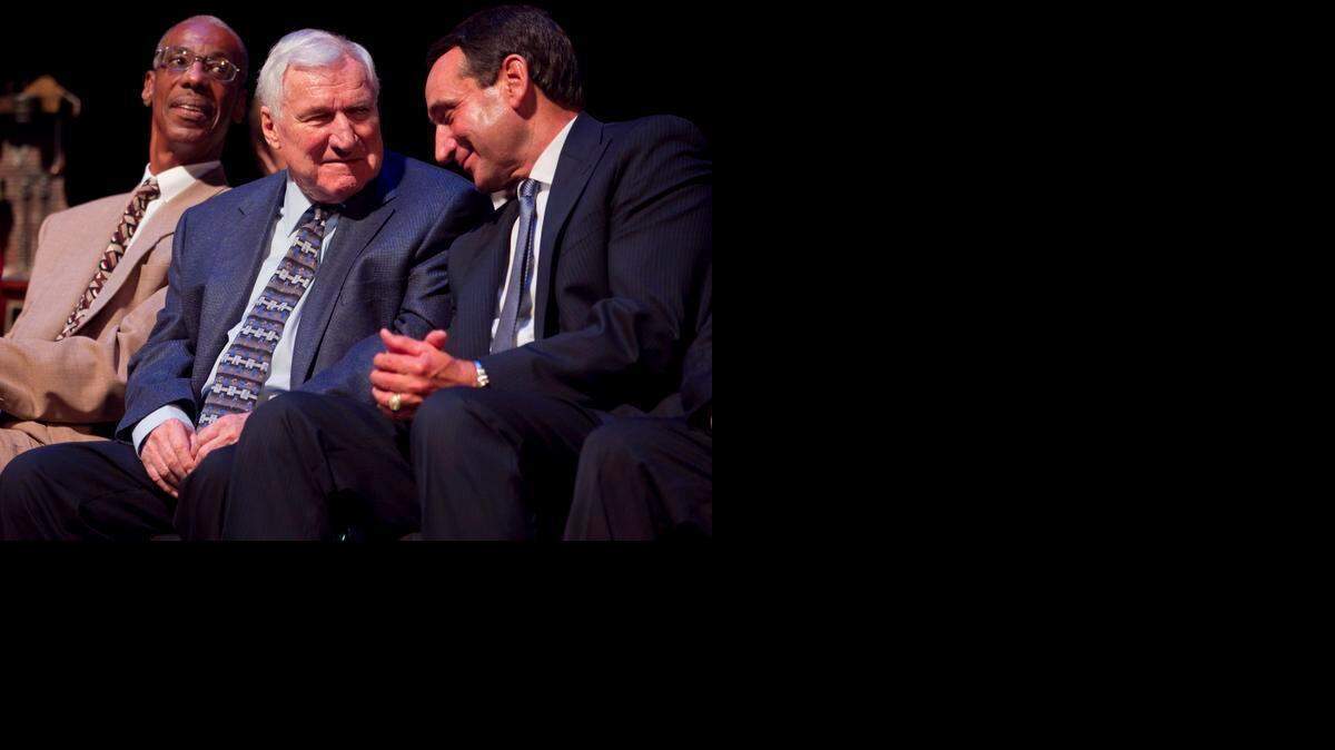 
Duke coach Mike Krzyzewski, right, acknowledges former North Carolina coach Dean Smith, who was honored with the Dr. James A. Naismith Good Sportsmanship Award Wednesday, June 29, 2011 at Memorial Auditorium in Raleigh, North Carolina. (Robert Willett/Raleigh News & Observer) 
