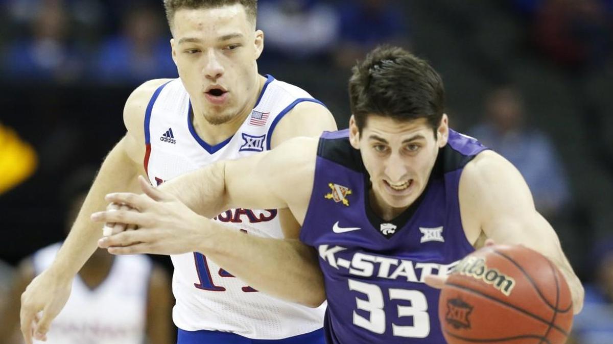 K-State guard Brian Rohleder, front, received a scholarship for the first time in his senior season and additional revenue to cover the full cost of attendance.
