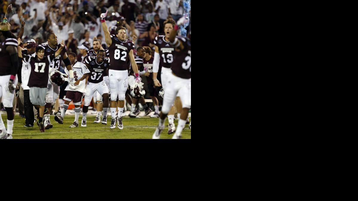 
Mississippi State players celebrate the team’s 38-23 win over No. 2 Auburn in their NCAA college football game in Starkville, Miss., Saturday (Oct 11, 2014) 
