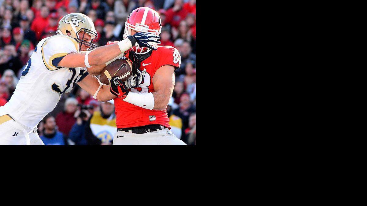 
Georgia Tech linebacker Tyler Marcordes (35) blocks the pass to Georgia tight end Jeb Blazevich (83) during the second half of an NCAA college football game Saturday, Nov. 29, 2014, in Athens, Ga. Georgia Tech won 30-24 in overtime after Georgia quarterback Hutson Mason's pass was intercepted by D.J. White. (AP Photo/David Tulis) 
