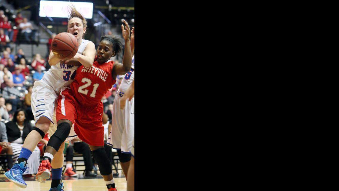 
Hutchinson Community College’s Clemence LeFebvre (34) and Coffeyville’s Caletria Curtis (21) grab for a rebound during the first half Saturday at Koch Arena.
