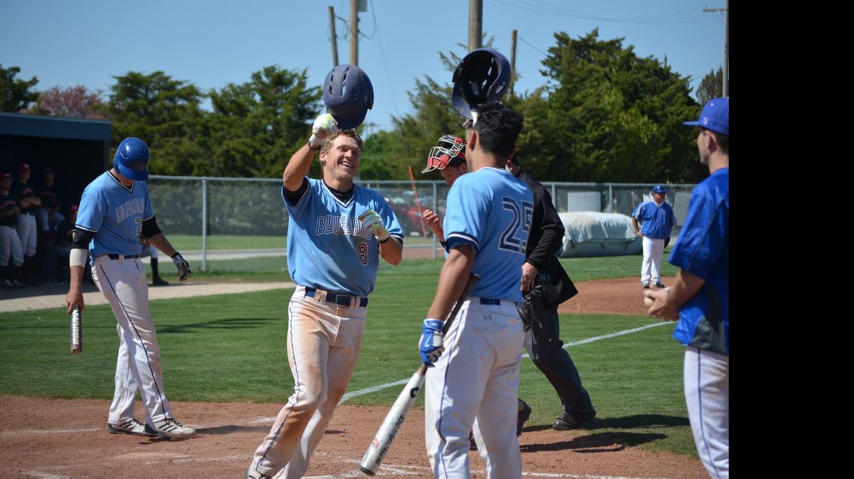 
Tabor College center fielder Jerrik Sigg (8) celebrates after hitting a home run against McPherson on April 21 in Hillsboro. The Bluejays have won four straight KCAC regular-season titles. 
