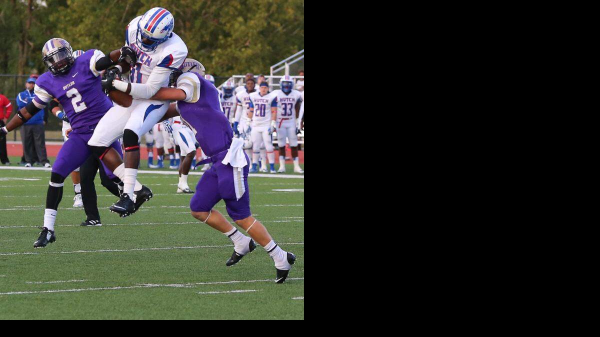 
Hutchinson’s Juwan Dickey goes up for the ball between two Butler defenders on Saturday in El Dorado. Dickey finished with eight catches for 144 yards and three touchdowns as Hutchinson beat Butler for the first time since 1997. 

