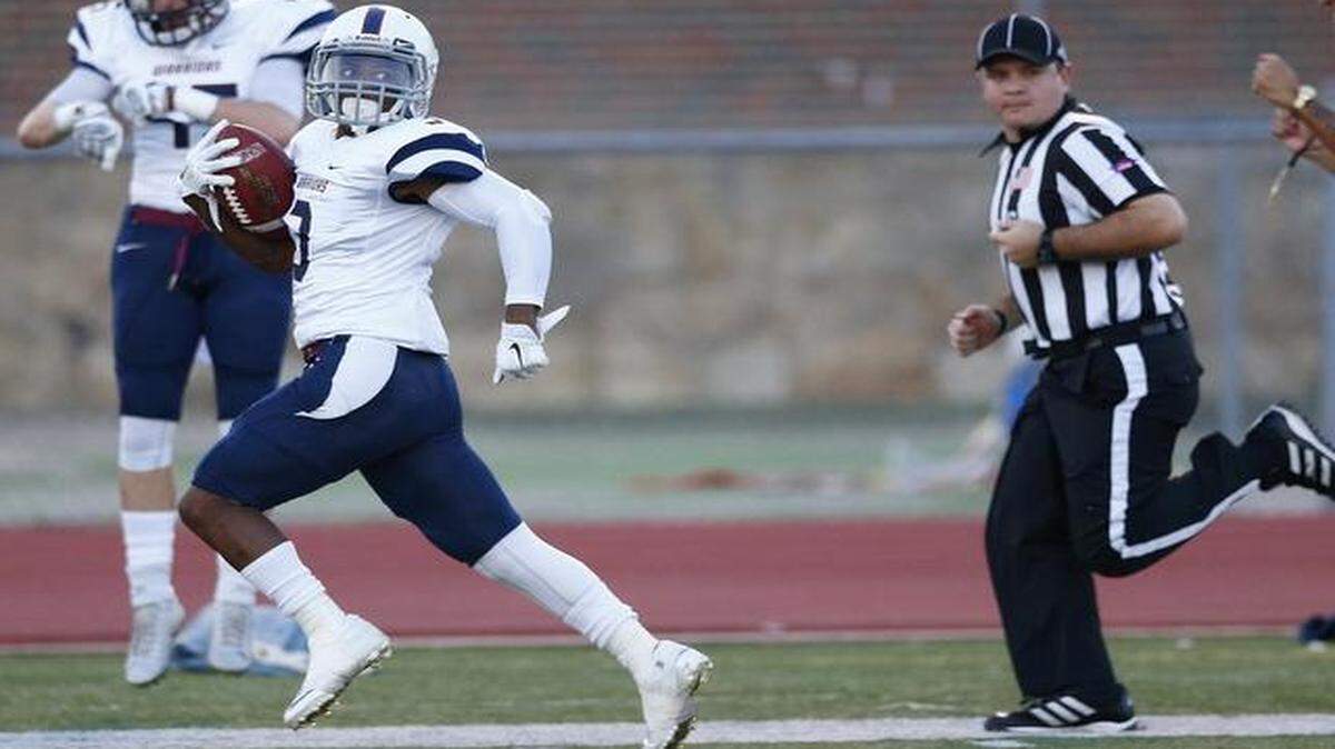 
Sterling's Antonio Bray runs for a touchdown against Friends in the first quarter on Saturday night in Wichita.
