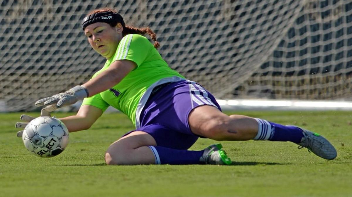 Butler Community College goalkeeper Jami Reichenberger stops a shot against Schoolcraft (Mich.) on Monday in the NJCAA Tournament in Melbourne, Fla.