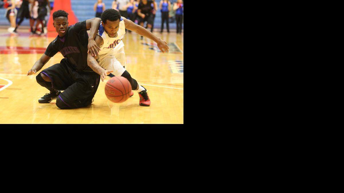 
Butler's Derrick Byrd and Hutchinson's Akbar Hoffman scramble after a loose ball in the second half at the Sports Arena on Wednesday night.
