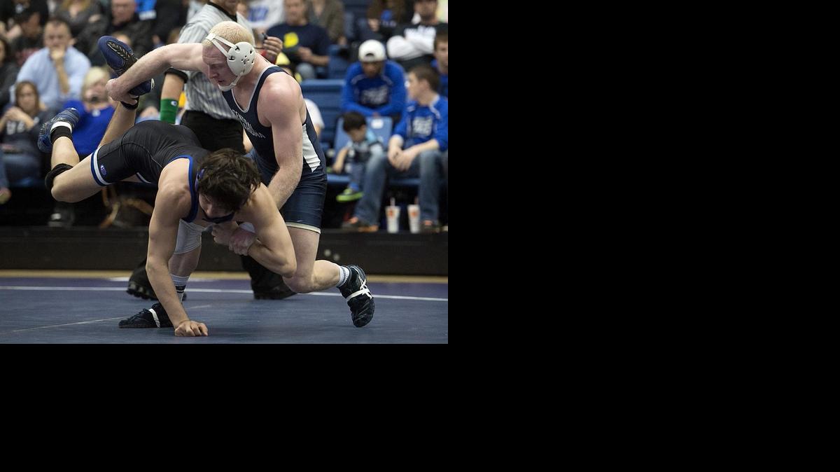
Central Oklahoma wrestler and Andover native Chris Watson, right, wrestles in the NCAA Division II Tournament last month in St. Louis. Watson won the 165-pound national title and was named NCAA Division II Wrestler of the Year. Two weeks later he discovered he’d been competing with a potentially deadly blood clot in his right arm. 

