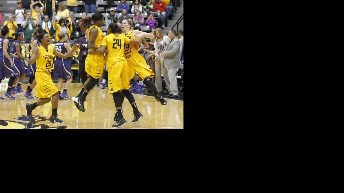 
Wichita State's Jaleesa Chapel, Jamillah Bonner, Kelsey Jacobs and Alex Harden celebrate the Shockers' 51-48 win over Kansas State on Friday night at Koch Arena. 
