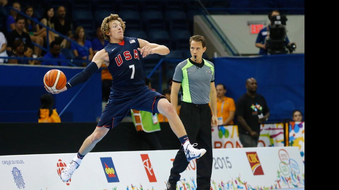 
Ron Baker saves a ball from going out of bounds against the Dominican Republic during the first half of their bronze medal basketball game at the Pan Am Games in Toronto, Saturday July 25, 2015. 
