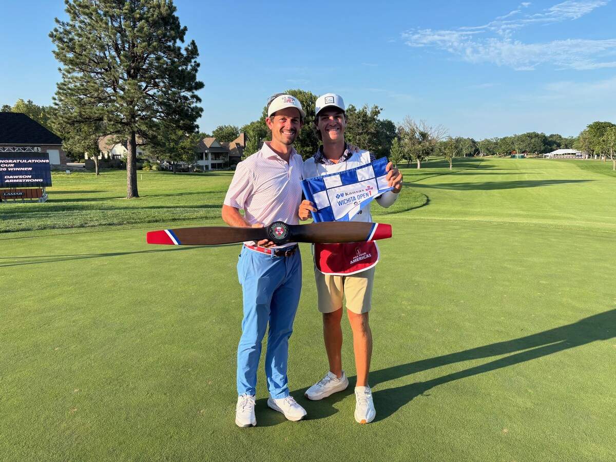 Dawson Armstrong holds the Wichita Open’s trophy alongside local caddie Max Farber after winning a six-hole playoff Sunday at Crestview Country Club. Farber, a recent Bishop Carroll graduate, was on the bag for Armstrong’s championship run.