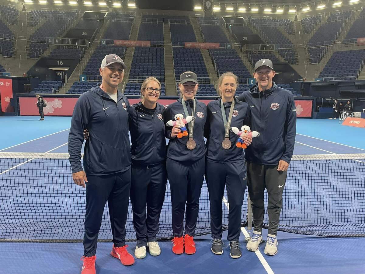 Sterling High senior Chelsie Brown (middle) is pictured with her teammate, Emily Hangstefer (middle right), after the pair won a bronze medal in the women’s tennis doubles tournament at the Deaflympics in Tokyo, Japan.