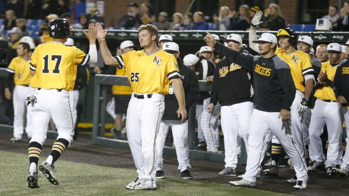 Wichita State players greet Trey Vickers (17) after he scored the go-ahead run against Kansas in the eighth inning Tuesday at Eck Stadium.