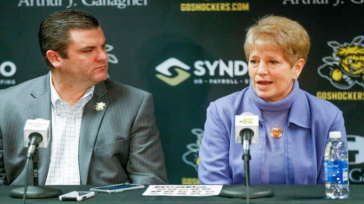 Wichita State athletic director Darron Boatright, left, listens to interim coach Linda Hargrove during her introductory news conference Jan. 23.