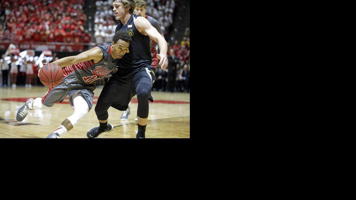 
Utah guard Brandon Taylor drives around Wichita State guard Ron Baker in the second half on Wednesday night in Salt Lake City.
