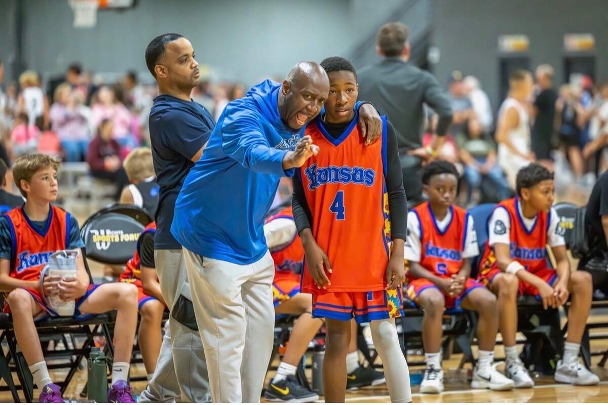 Tyrone Berry coaches Team PE 34 during a summer tournament game, using an old-school approach that still connects with today’s youth because of his willingness to adapt.