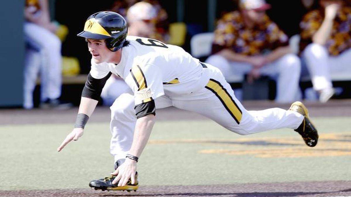 
Wichita State’s Willie Schwanke prepares to slide home safely against Central Michigan in the fifth inning Sunday at Eck Stadium.
