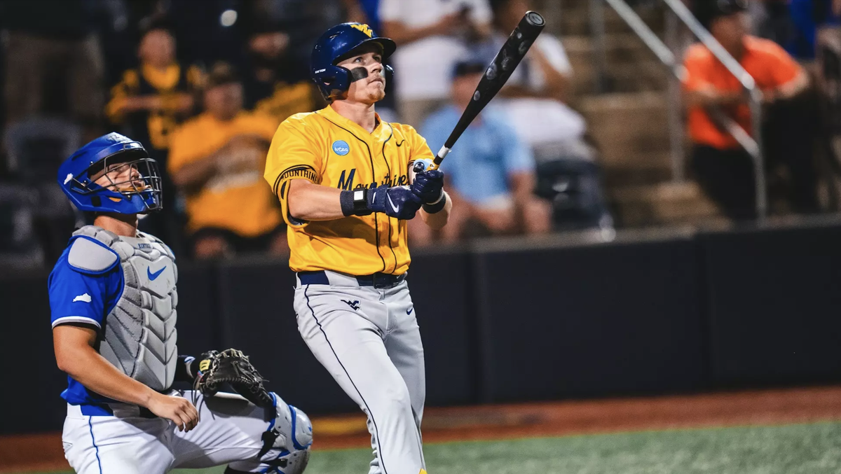 Wichita native and Bishop Carroll graduate Paul Schoenfeld launches a go-ahead two-run home run in the top of the ninth inning Sunday to lift West Virginia to an 11-9 comeback win over Kentucky in an NCAA Regional elimination game.