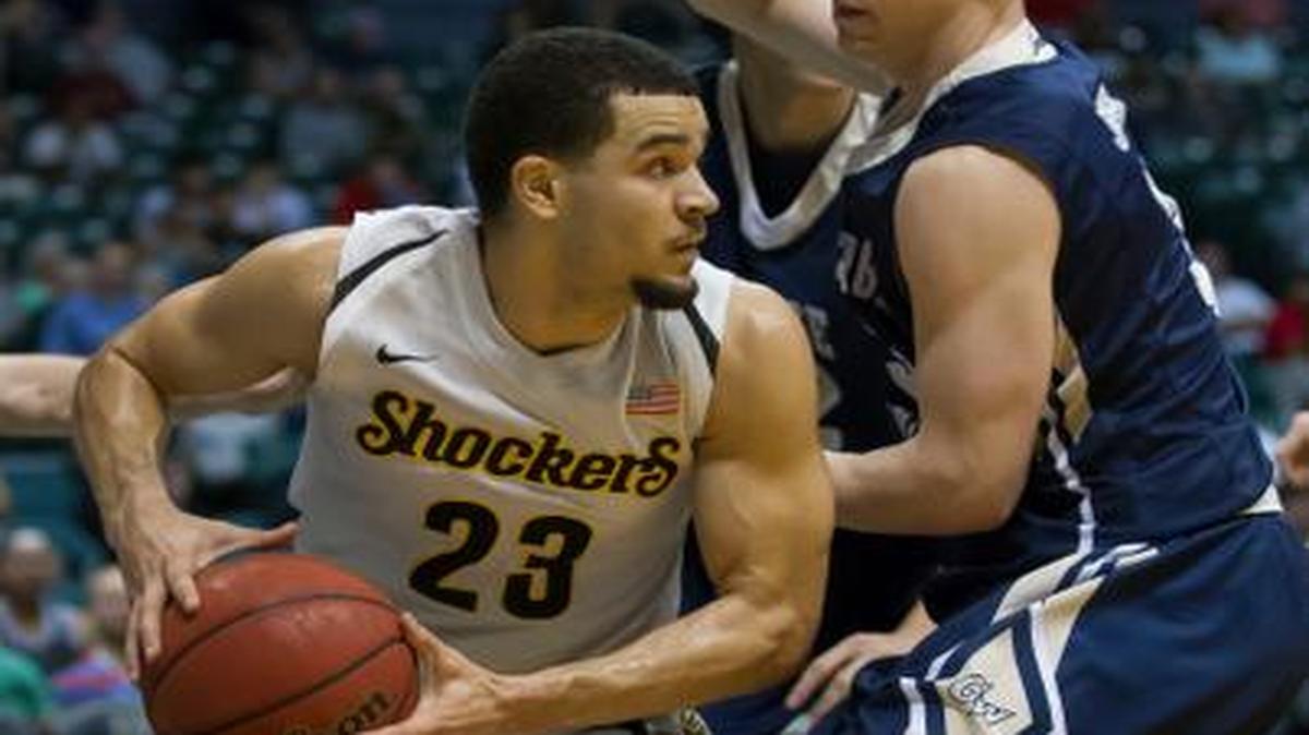 
Wichita State guard Fred VanVleet looks for a teammate to pass to while defended by George Washington’s Paul Jorgensen in the first half Thursday at the Diamond Head Classic in Honolulu. 
