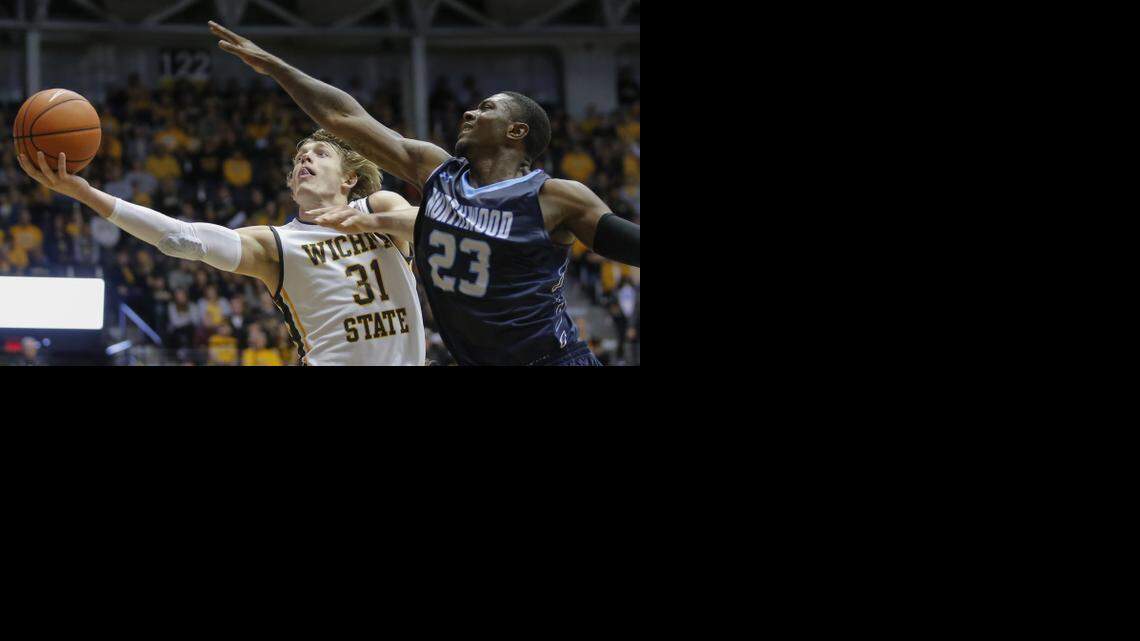 
Wichita State's Ron Baker flies past Northwood’s Fred Mattison during the second half on Saturday of Wichita State's season-opening exhibition game.
