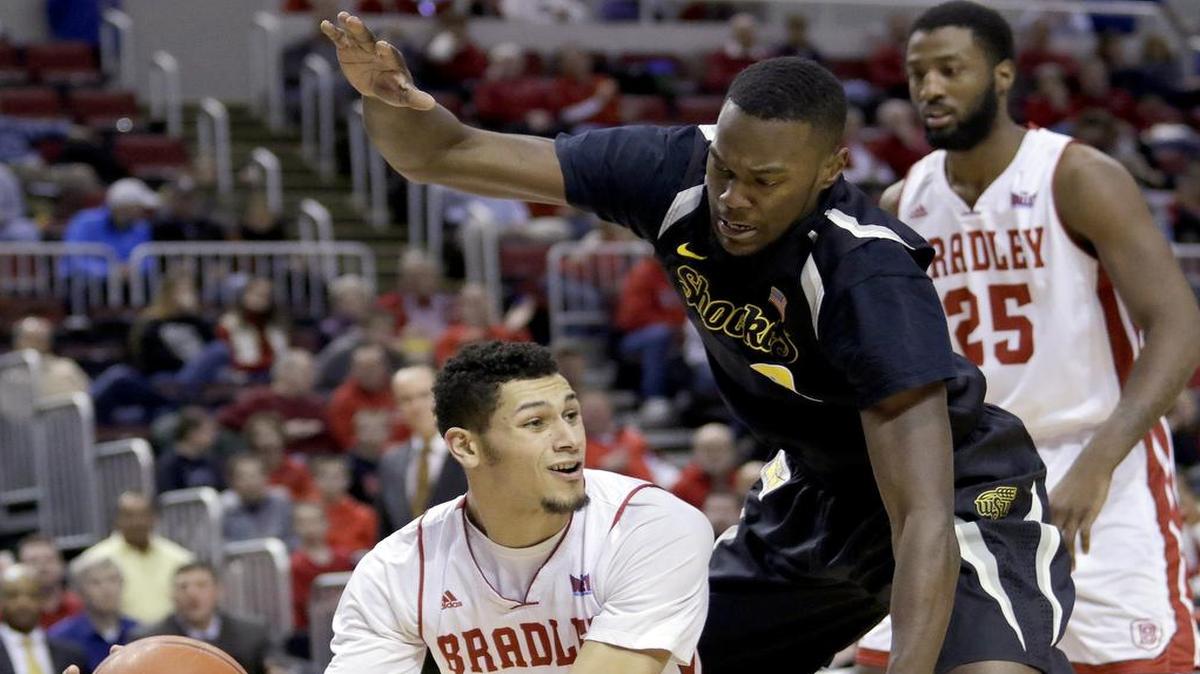 
Wichita State forward Tevin Glass tries to defend Bradley forward Auston Barnes during a game in February. Glass, who played one season at WSU, will transfer to East Tennessee State. 
