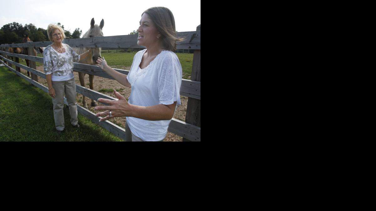 
Valory Edwards hangs out with her mom Diane Buatte at her home near Springfield, Mo. She was not yet born when her father, Mal Kimmel, died in the Wichita State plane crash.
