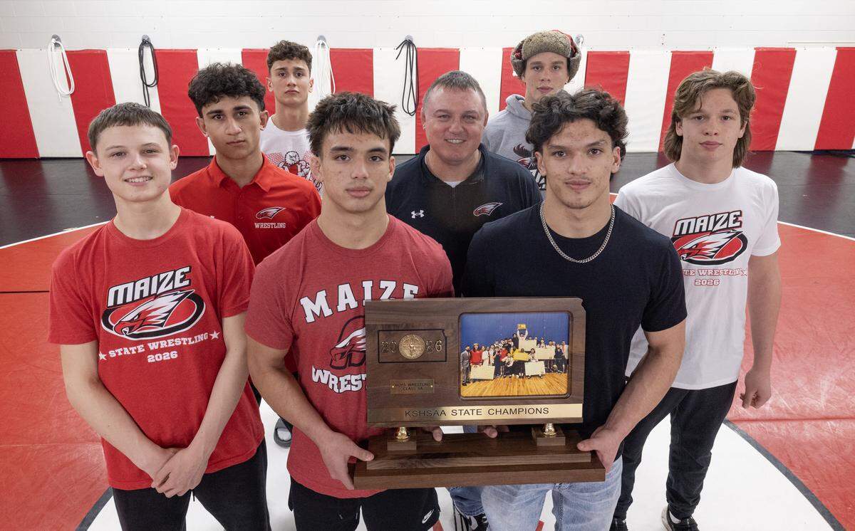 The Maize boys wrestling team won the Class 6A state championship with a record-setting score behind family bonds that included three sets of brothers and a father-son pairing. From left to right: Cooper Smith, Talon Verbeck, Tucker Verbeck, Baron Rosas, Ryan Smith, Everett Joyce, Vincent Rosas and Reid Joyce.