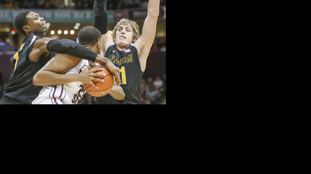 
WSU's Cleanthony Early, left, and Ron Baker pressure Missouri State's Gavin Thurman in the second half at Springfield, Mo., last January.
