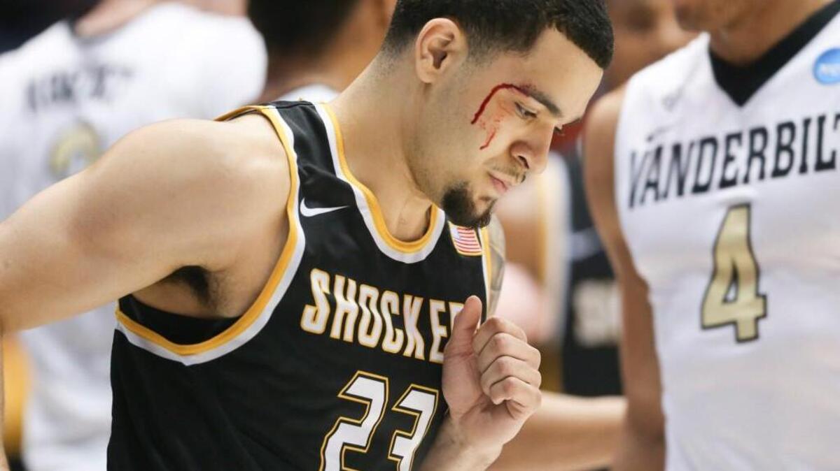 Wichita State guard Fred VanVleet is bloodied after taking an elbow to the face from Vanderbilt forward Jeff Roberson during the first half Tuesday in Dayton, Ohio.