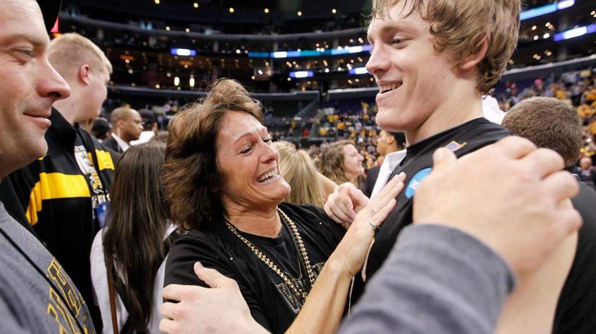Neil and Ranae Baker hug their son, Ron, after Wichita State’s West Regional final victory over Ohio State in 2013. Baker who as a freshman who missed most of the season with an injury but returned for the postseason and played an integral role.