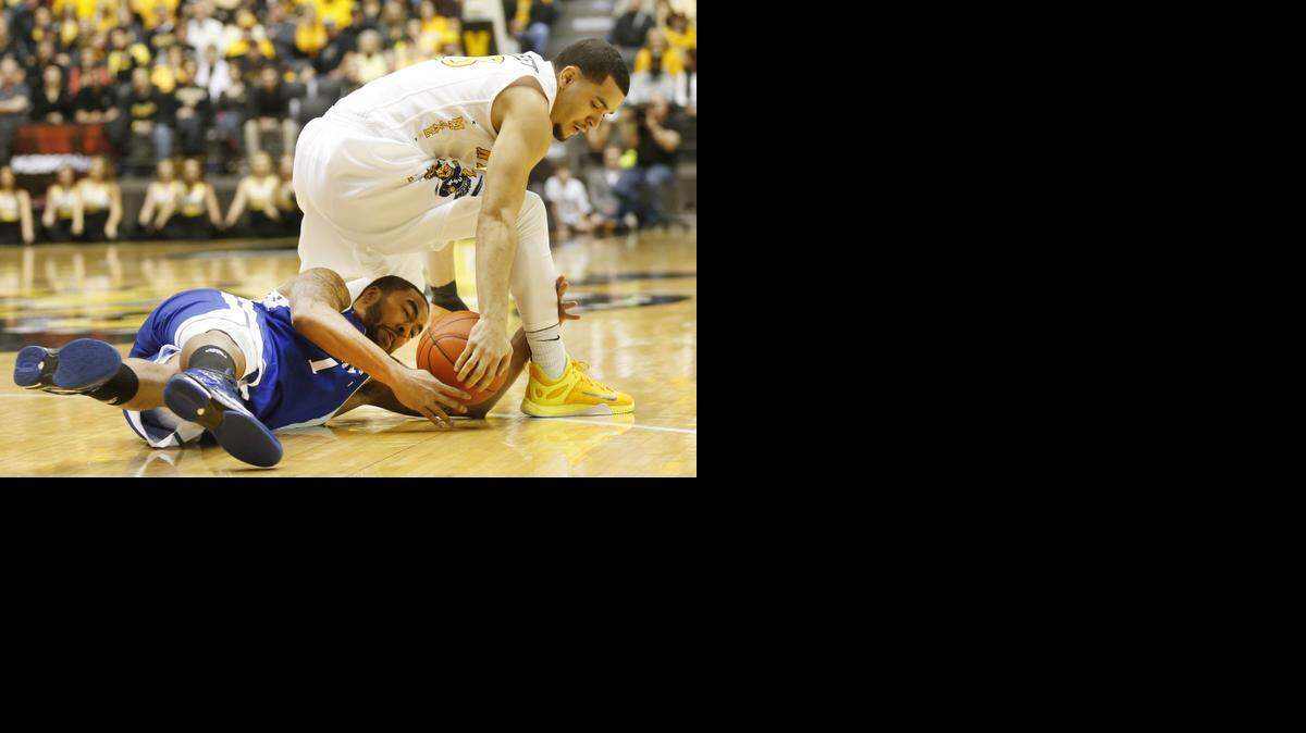 
Wichita State's Fred VanVleet and Drake's Karl Madison scramble for the ball on Sunday. (Jan. 25, 2015) 
