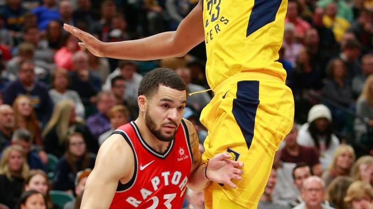 Toronto Raptors guard Fred VanVleet (23) pushes his way around Indiana Pacers center Myles Turner on Friday in Indianapolis.
