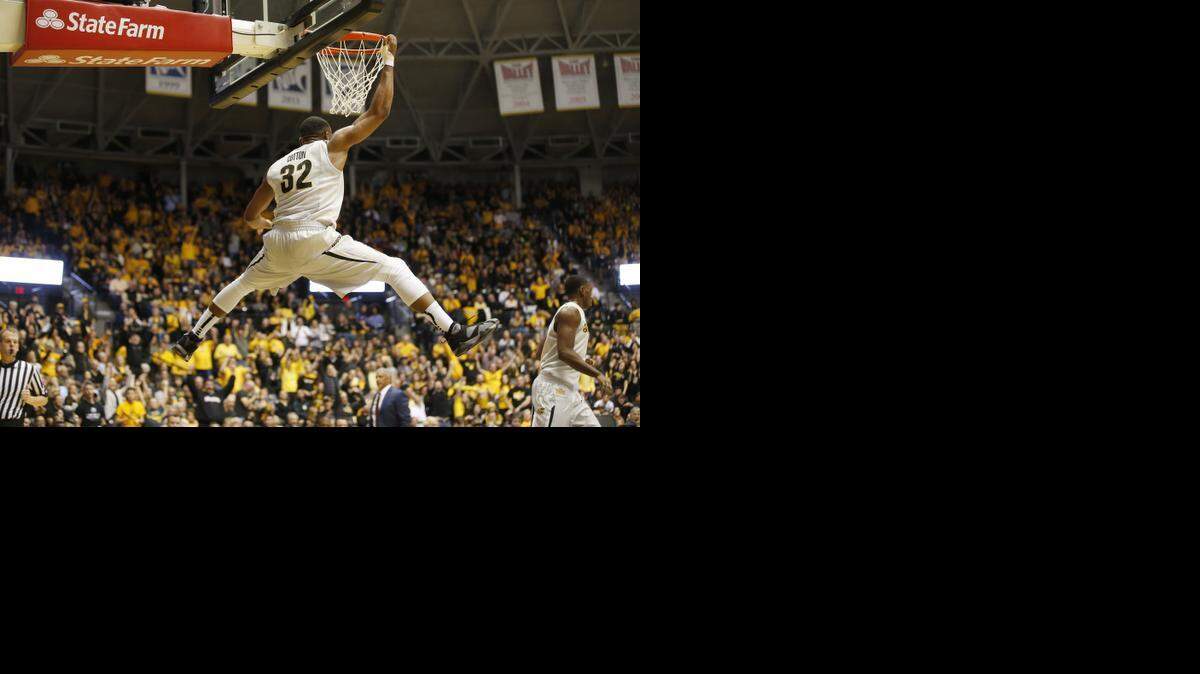 
Wichita State’s Tekele Cotton dunks the ball in the first half against New Mexico State. 
