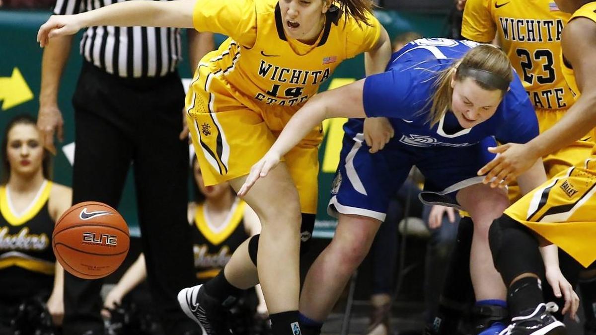 Wichita State University's Marija Pacar, left, and Drake's Maddy Dean get tangled up going after a loose ball in the second quarter Sunday afternoon at Koch Arena.