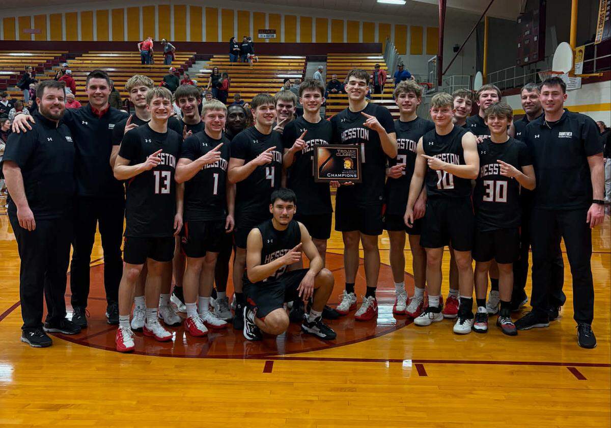 The Hesston boys basketball team prevailed in a triple-overtime classic over Moundridge to capture the Trojan Classic championship on Saturday night in Hillsboro.