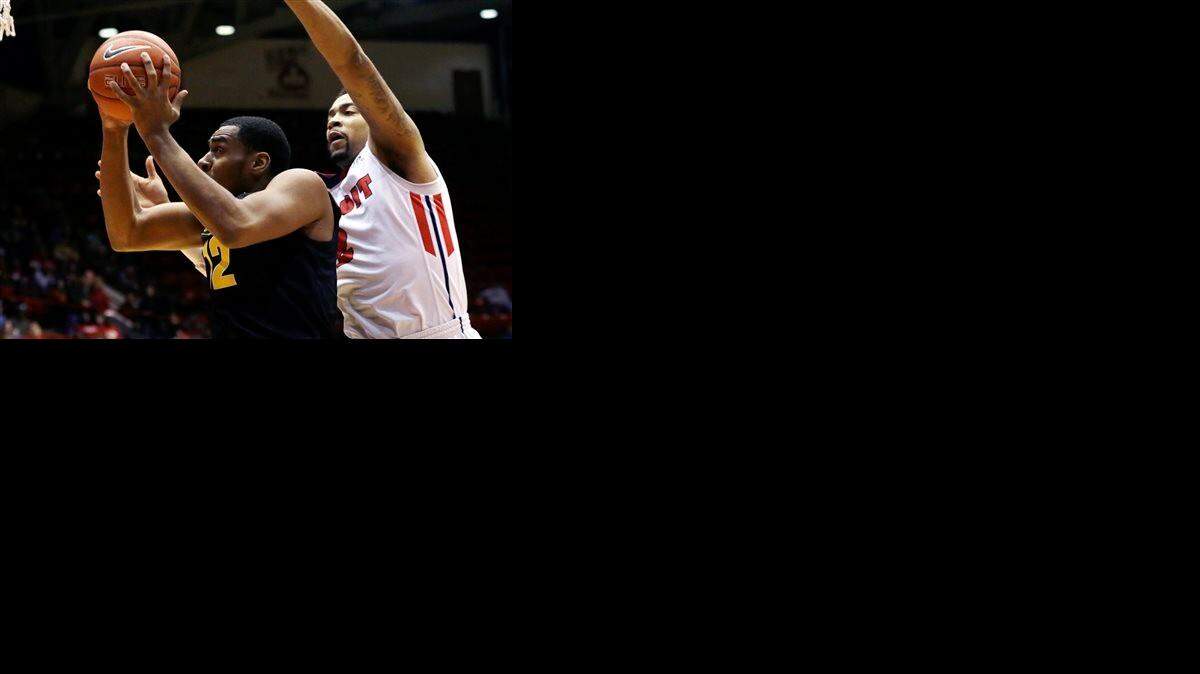 
Wichita State forward Darius Carter, left, defended by Detroit forward Juwan Howard Jr., attempts to shoot during the first half of an NCAA college basketball game in Detroit, Saturday, Dec. 13, 2014. 
