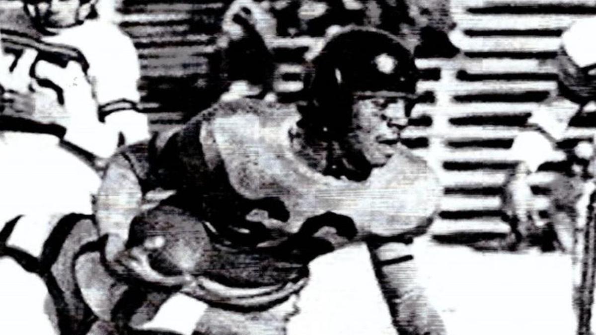 Linwood Sexton carries the football for the University of Wichita in a game at Veterans Field (now Cessna Stadium). Sexton was the greatest running back in Shocker history and one of two players to have his jersey number retired.