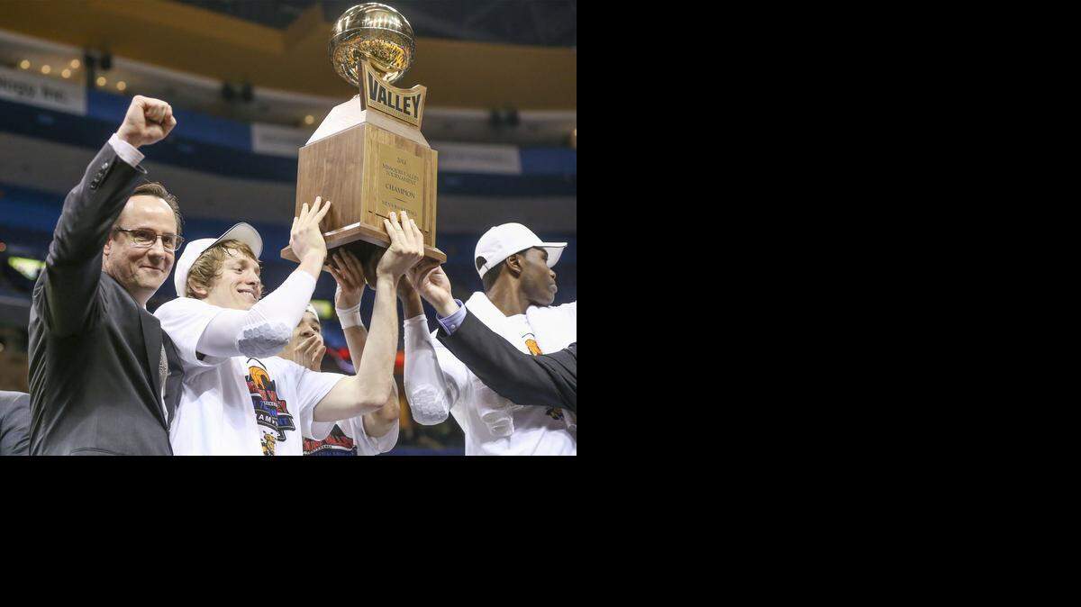 
Wichita State coach Gregg Marshall raises his fist as his team holds up the championship trophy after winning the Missouri Valley Conference Tournament in St. Louis last March.
