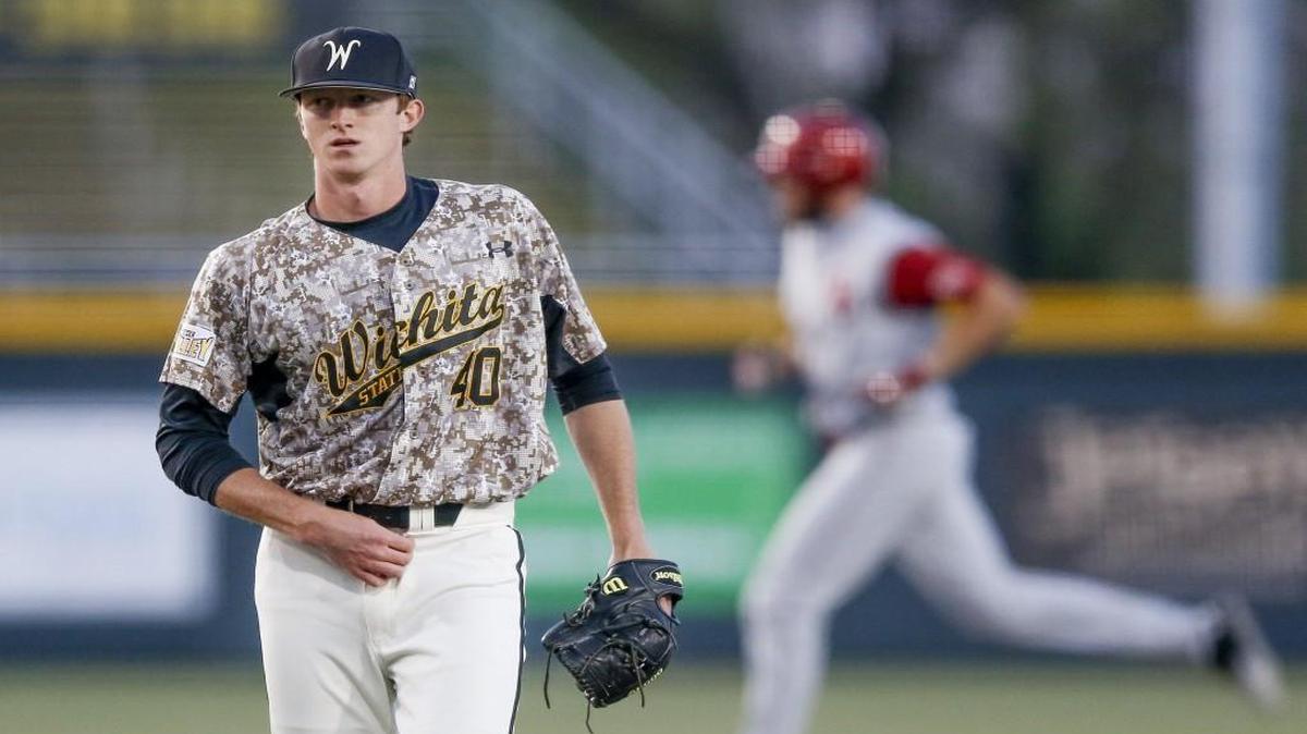 Wichita State relief pitcher Clayton McGinness walks around the mound as OU’s Cody Thomas runs the bases after hitting a home run in the fourth inning Tuesday at Eck Stadium.