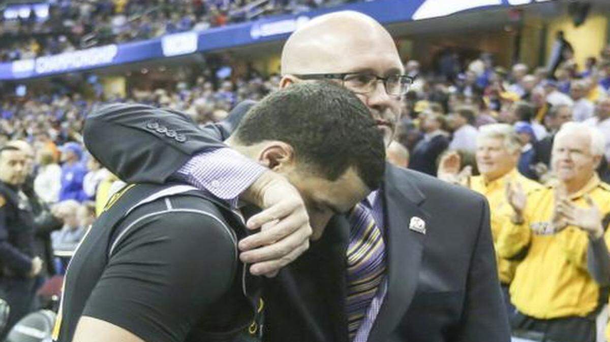 
Wichita State guard Fred VanVleet walks off the court with assistant coach after the Shockers were defeated by Notre Dame 81-70 in the Midwest Regional semifinal at Quicken Loans Arena in Cleveland on Thursday.
