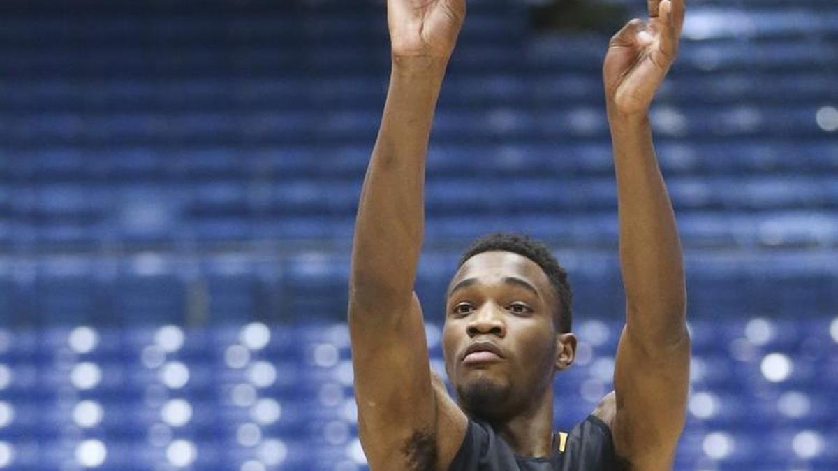 Markis McDuffie takes a shot during practice at UD Arena on Monday. His scoring has slumped since January. “I’ve been tired, dealt with some exhaustion here and there ... but I’ve kept fighting,” he said, “and I’m finally blessed to be in the NCAA Tournament.”